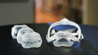 Mask with cushion attached and three additional sizes beside it