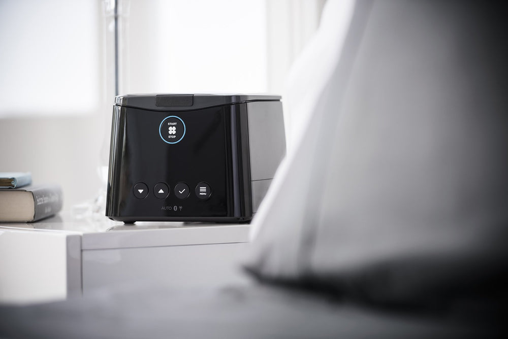 SleepStyle Auto CPAP device sitting on nightstand