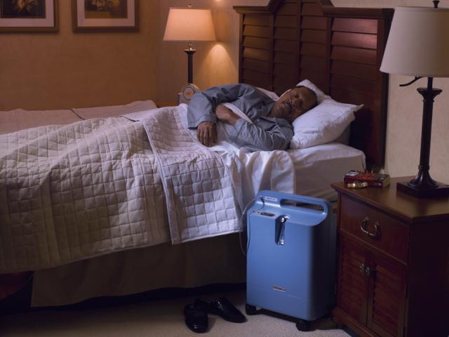 Man sleeping with Everflo next to his bed